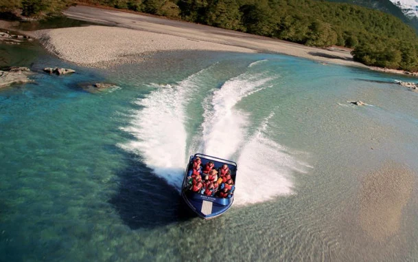 Jet boat travelling on the Dart River near Queenstown